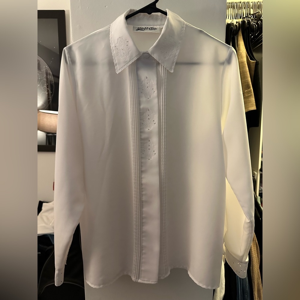 White long sleeve button up shirt with unique designs in the collar